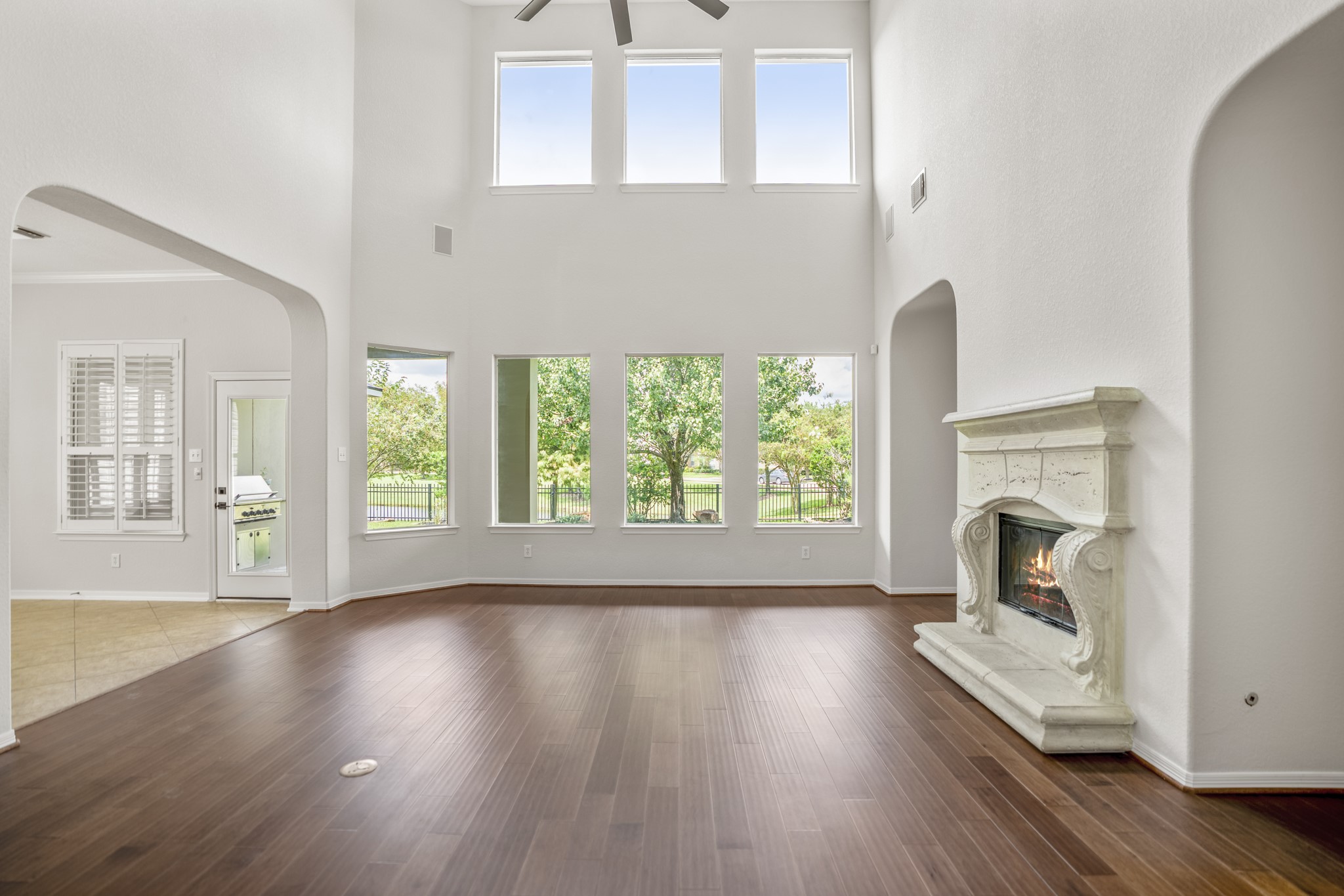 18602 Yorkshire Manor Court Spring, TX 77379 - Photo 11 of 50 wooden floor fireplace and windows in an empty room