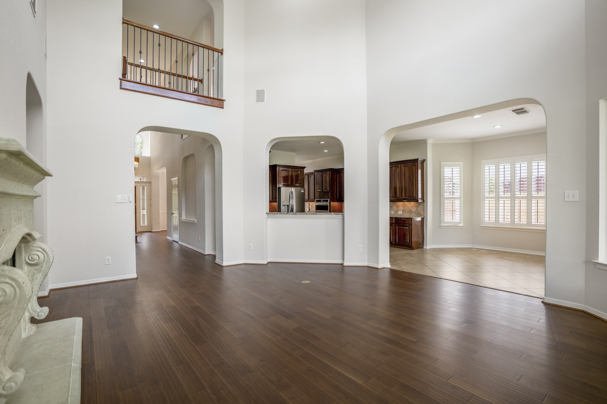 18602 Yorkshire Manor Court Spring, TX 77379 - Photo 13 of 50 a view of a hallway with wooden floor and a living room