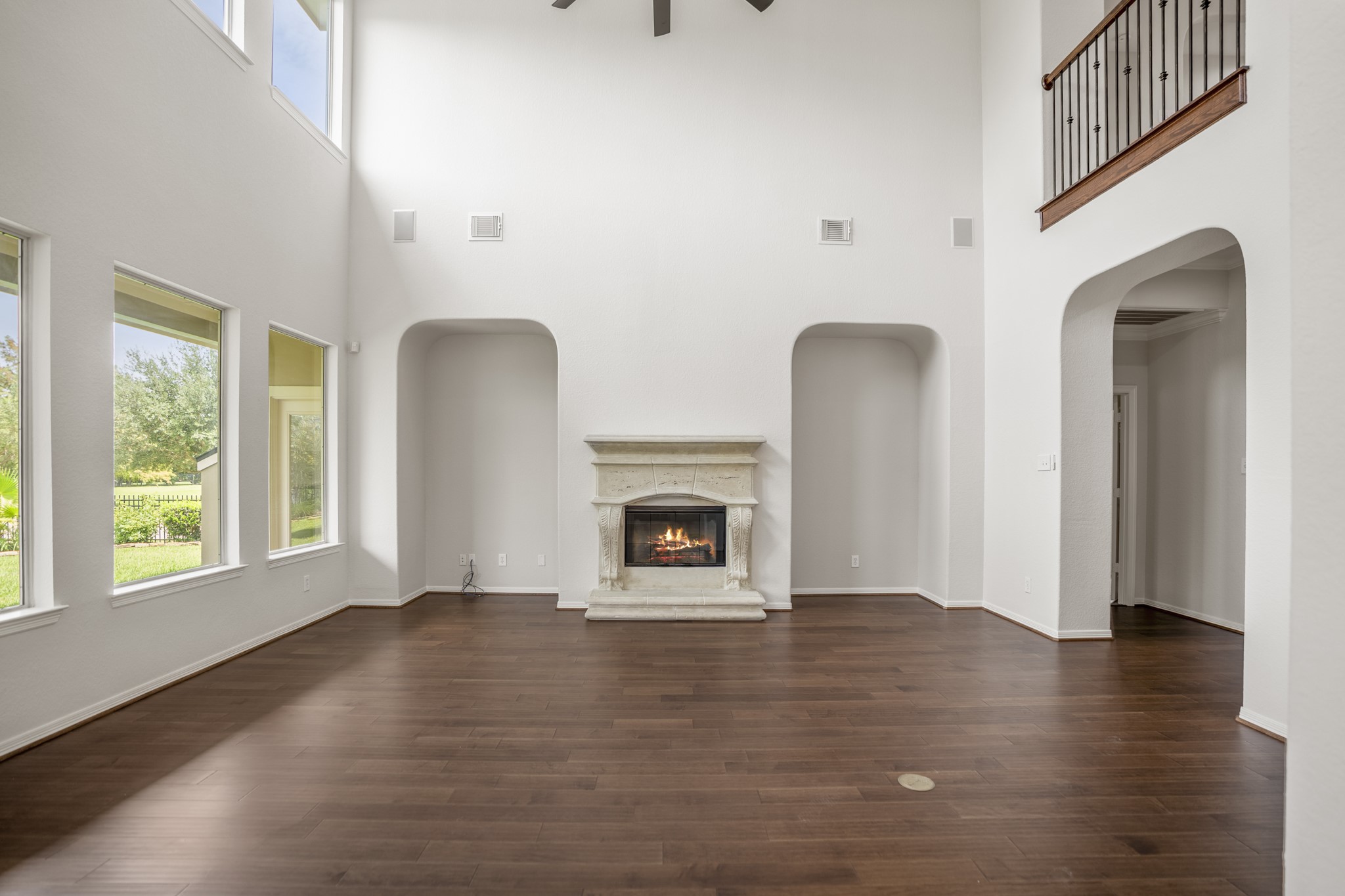 18602 Yorkshire Manor Court Spring, TX 77379 - Photo 14 of 50 a view of an empty room with wooden floor fireplace and a window