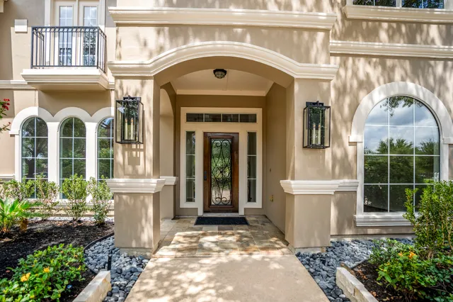 a front view of a house with garden