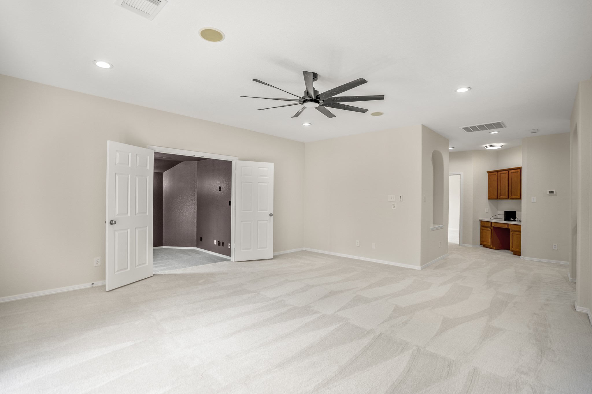18602 Yorkshire Manor Court Spring, TX 77379 - Photo 40 of 50 a view of an empty room with a ceiling fan
