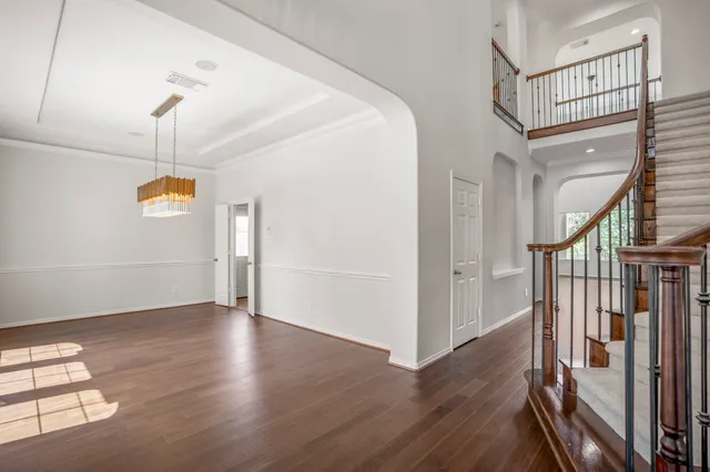 a view of entryway with stairs and wooden floor
