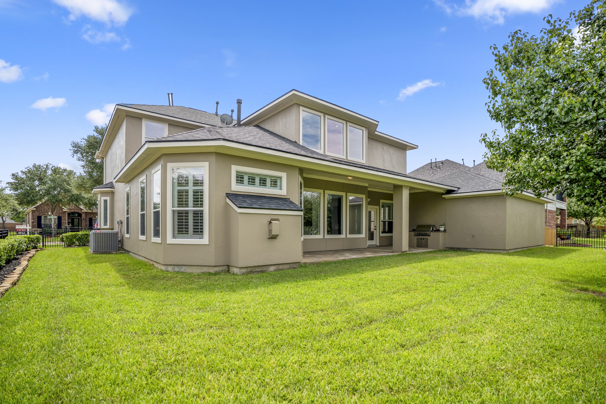 18602 Yorkshire Manor Court Spring, TX 77379 - Photo 46 of 50 a view of a house with a big yard and large trees