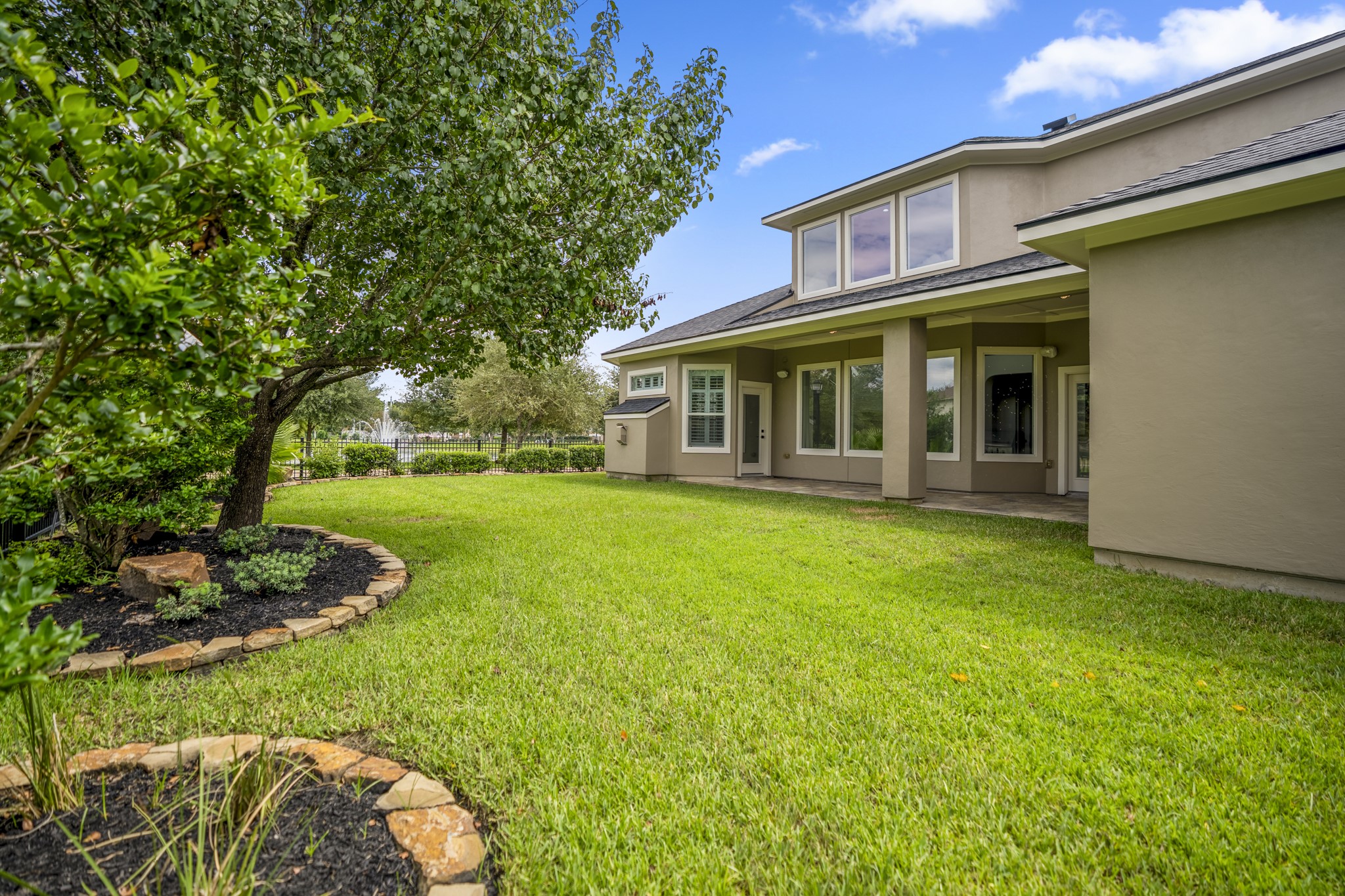 18602 Yorkshire Manor Court Spring, TX 77379 - Photo 48 of 50 a view of a house with garden and trees