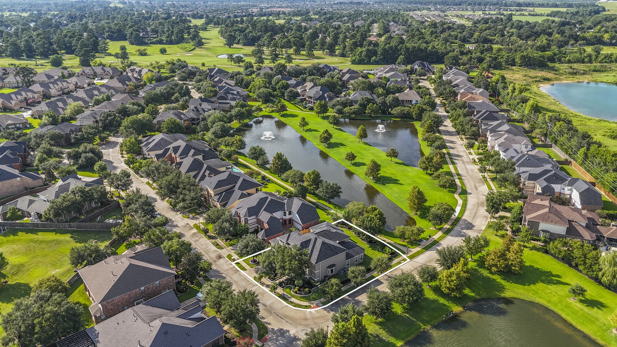 18602 Yorkshire Manor Court Spring, TX 77379 - Photo 49 of 50 an aerial view of residential houses with outdoor space and swimming pool