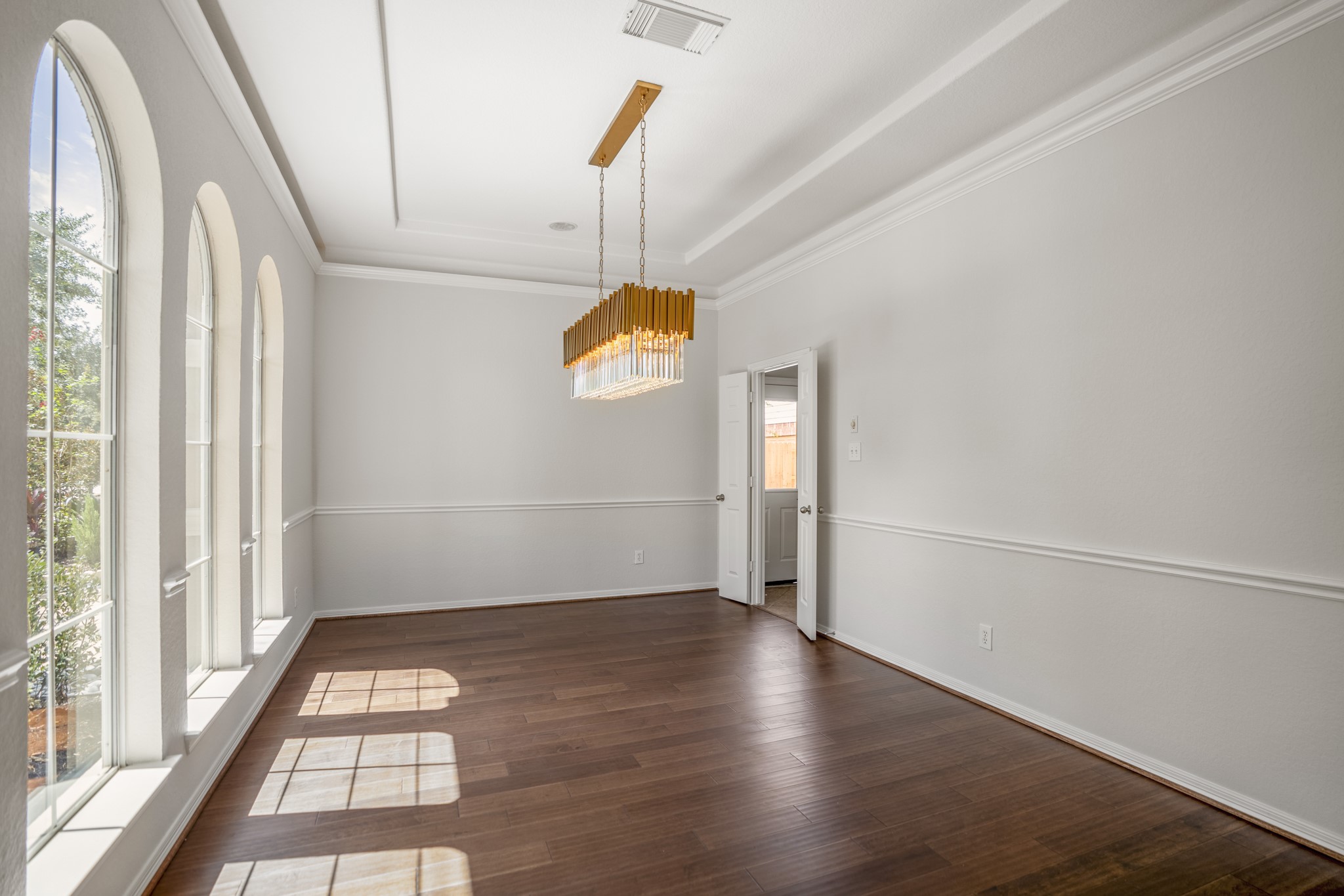 18602 Yorkshire Manor Court Spring, TX 77379 - Photo 5 of 50 an empty room with wooden floor and windows