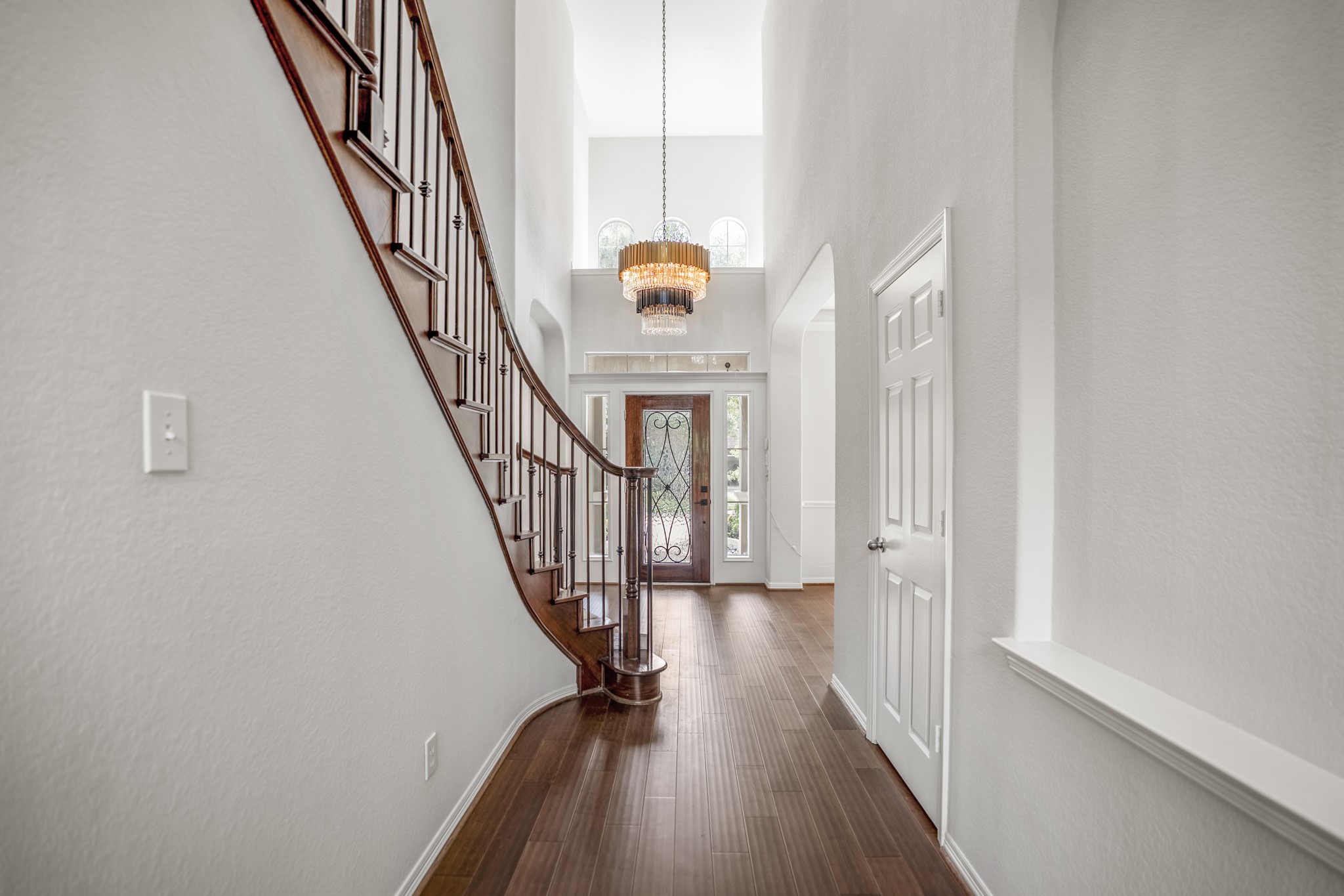 18602 Yorkshire Manor Court Spring, TX 77379 - Photo 10 of 50 a view of a hallway with wooden floor and staircase