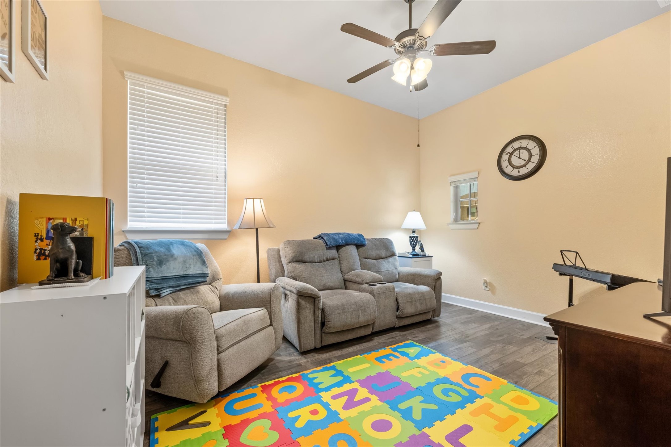 1004 Hezekiah Lane Leander, TX 78641 - Photo 24 of 36 Vaulted ceiling with a ceiling fan, wood-finish flooring, and multiple windows