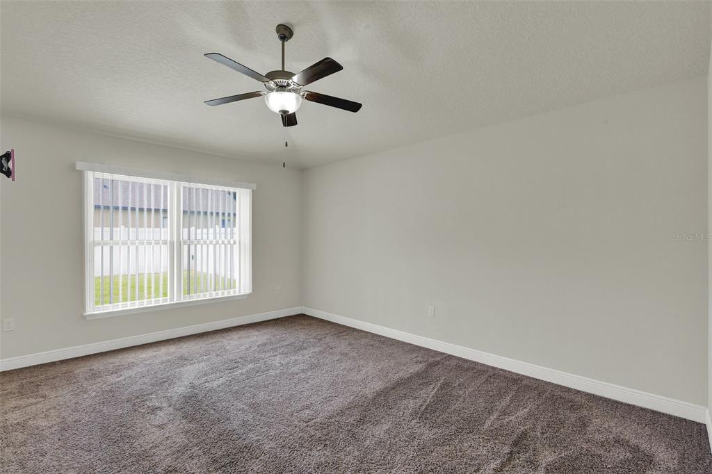 4229 Barnsley Lane Tavares, FL 32778 - Photo 12 of 20 a view of an empty room with a window