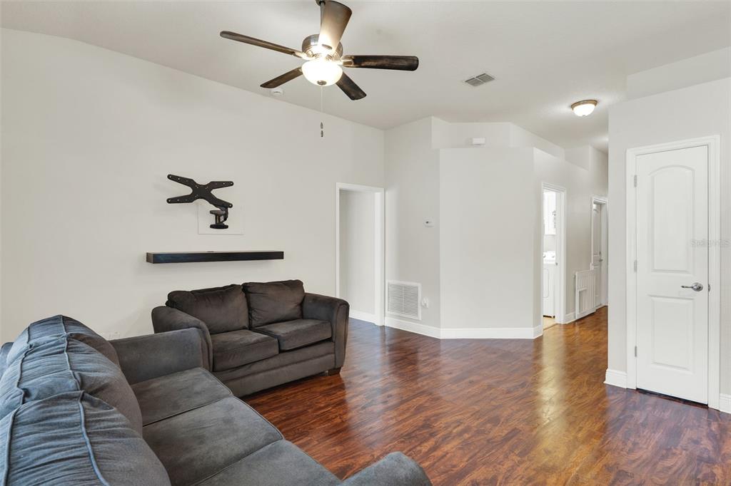 4229 Barnsley Lane Tavares, FL 32778 - Photo 3 of 20 a living room with furniture and a ceiling fan