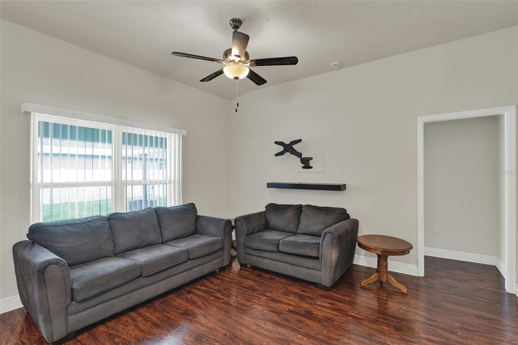4229 Barnsley Lane Tavares, FL 32778 - Photo 4 of 20 a living room with furniture and a window