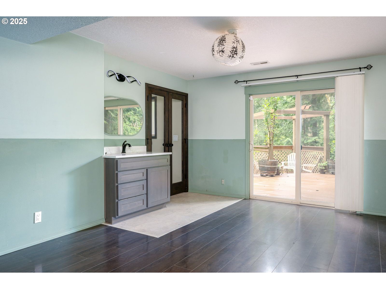 18335 Southeast 370th Avenue Sandy, OR 97055 - Photo 14 of 42 a kitchen with a wooden floor and a large window