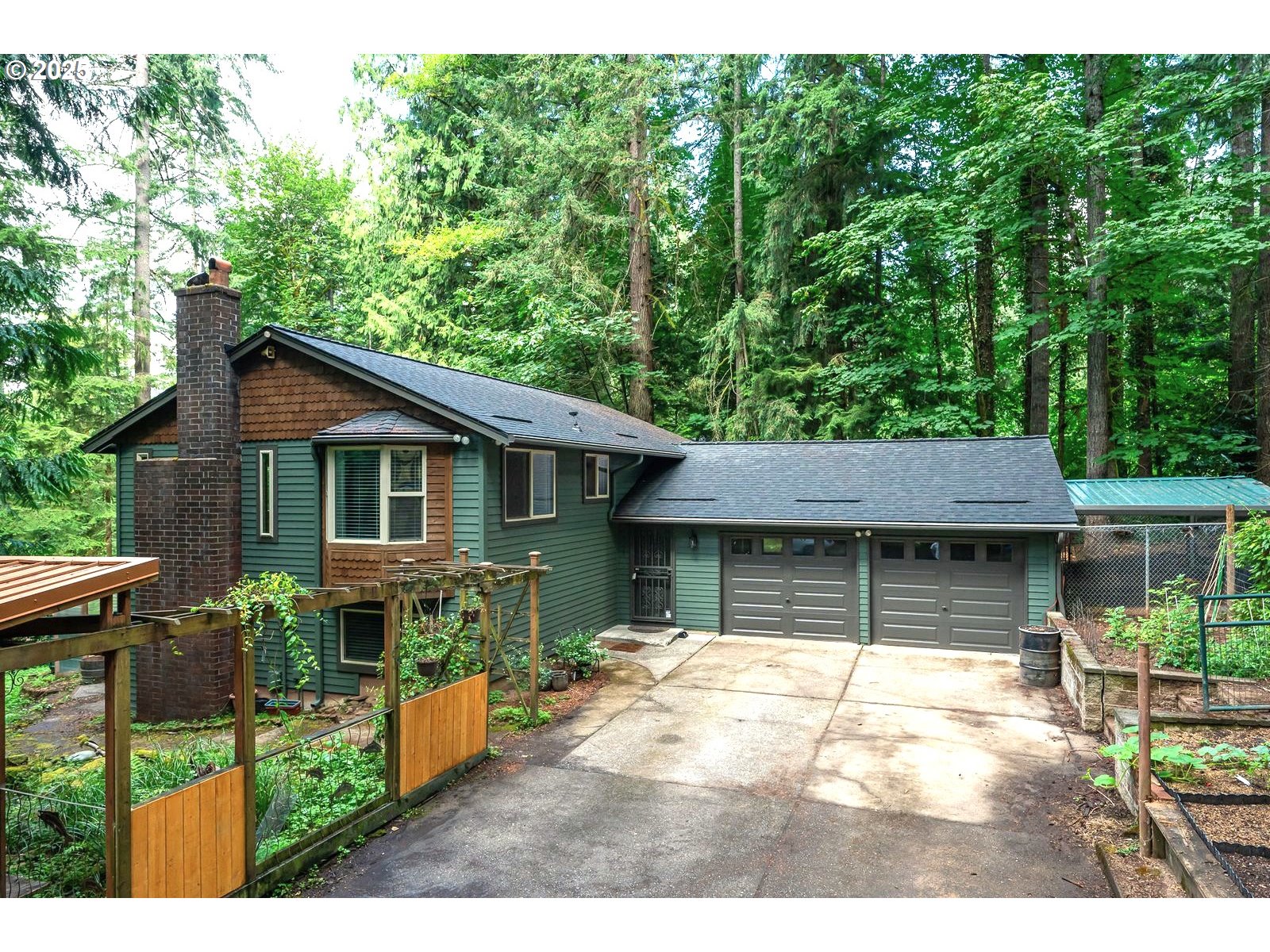 18335 Southeast 370th Avenue Sandy, OR 97055 - Photo 2 of 42 a front view of a house with garden