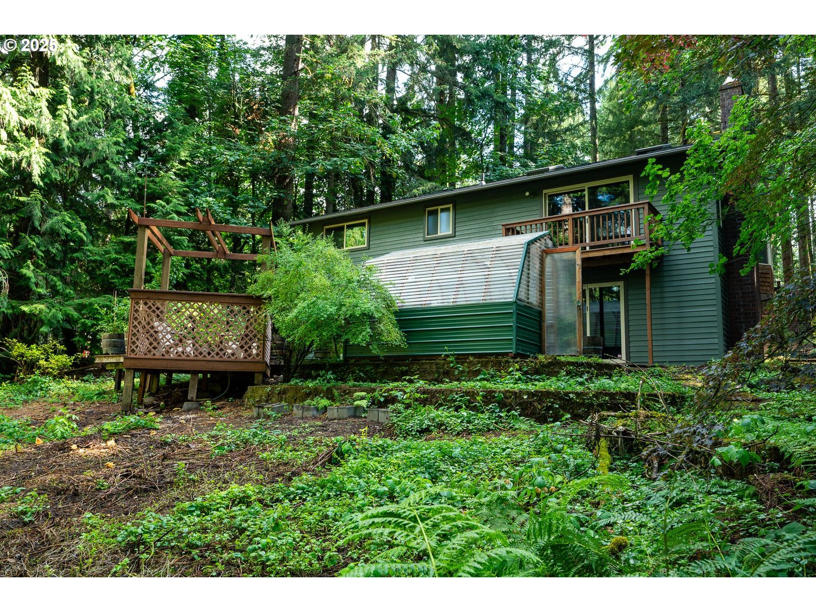 18335 Southeast 370th Avenue Sandy, OR 97055 - Photo 36 of 42 a backyard of a house with lots of green space