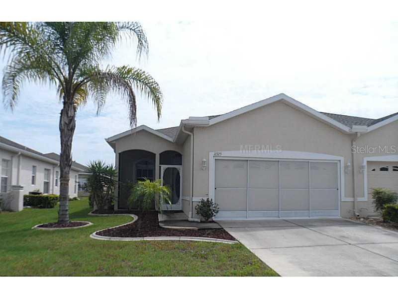 11325 Golf Round Drive New Port Richey, FL 34654 - Photo 1 of 1 a view of a yard in front of a house