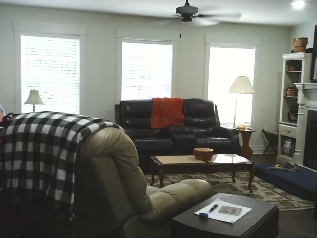 a living room with furniture and a window