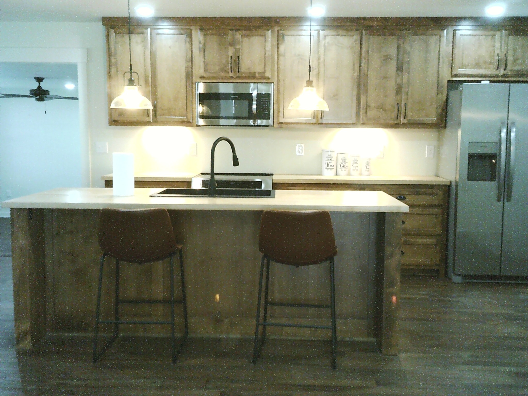 124 Hayes Fork Creek Road Dover, TN 37058 - Photo 16 of 29 a kitchen with stainless steel appliances a sink cabinets and wooden floor