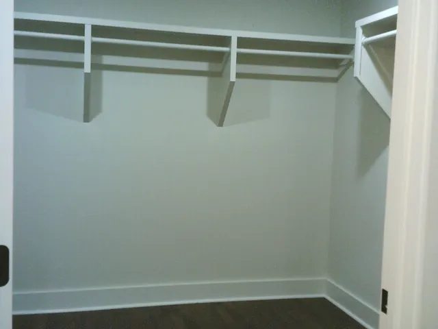 a bathroom with a bath tub with a shower