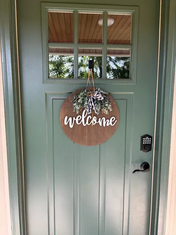 a view of a door and wooden floor
