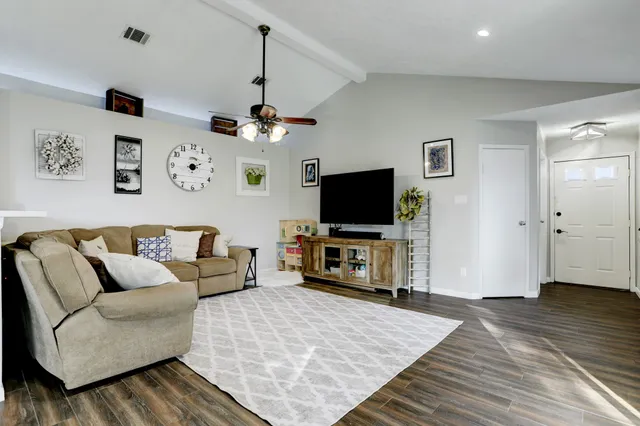 a living room with furniture and a large window