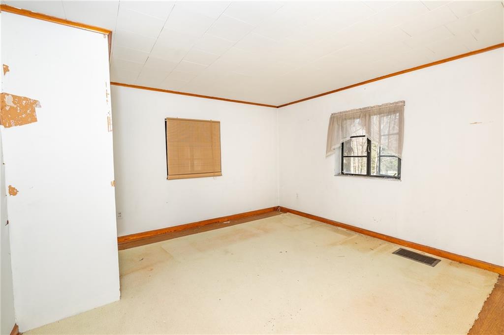 1313 Herman Road Cabot, PA 16023 - Photo 21 of 37 a view of an empty room with a window