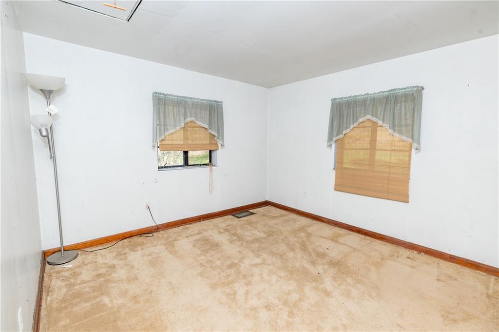 1313 Herman Road Cabot, PA 16023 - Photo 23 of 37 an empty room with a window