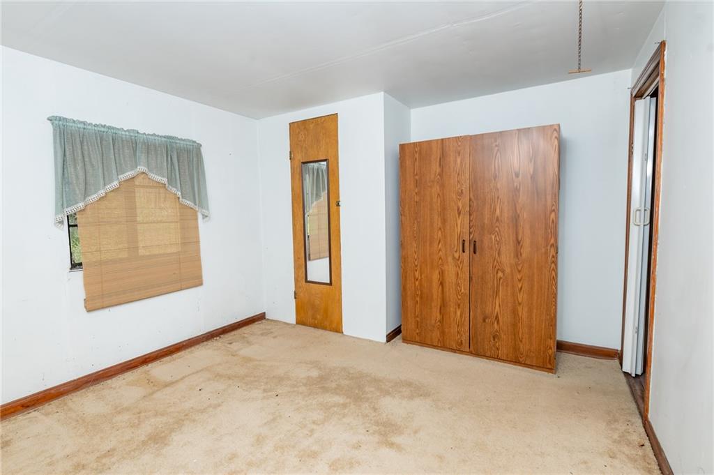 1313 Herman Road Cabot, PA 16023 - Photo 24 of 37 an empty room with windows and closet