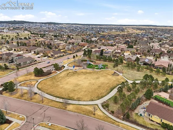 an aerial view of residential houses with outdoor space