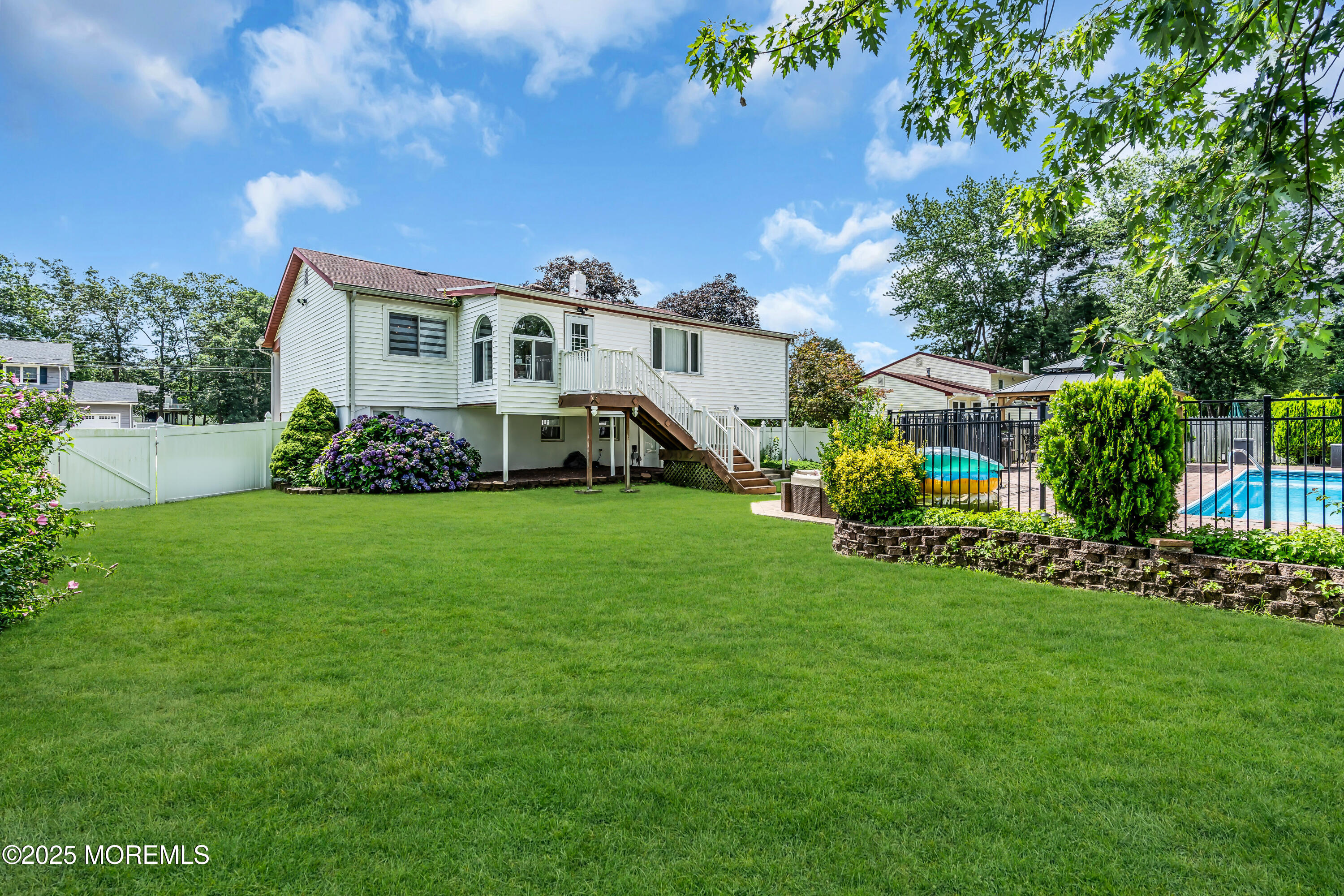 15 Windsor Road Howell, NJ 07731 - Photo 43 of 46 a front view of a house with a garden and trees