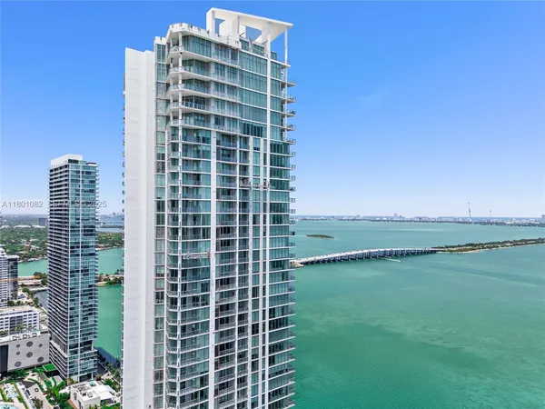 a view of ocean with a large building