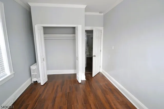 a view of wooden floor in an empty room
