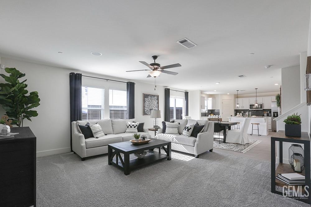 Undisclosed Address Bakersfield, CA 93314 - Photo 3 of 13 a living room with furniture and a large window