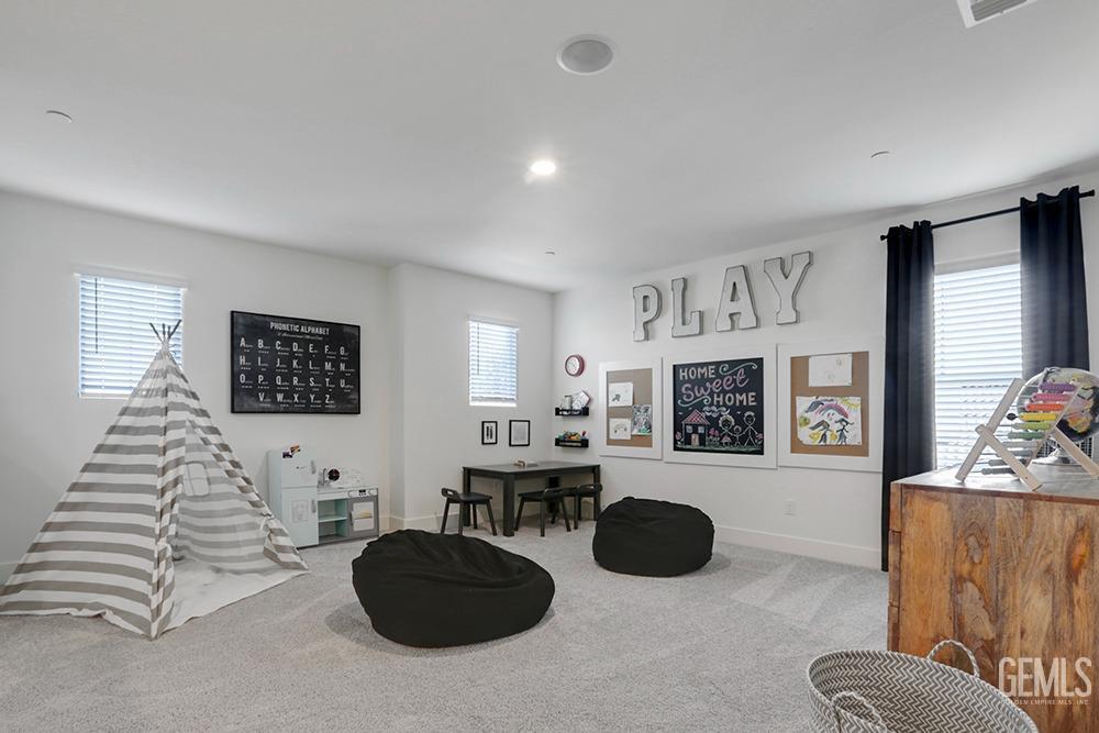 Undisclosed Address Bakersfield, CA 93314 - Photo 4 of 13 a living room with furniture and a flat screen tv