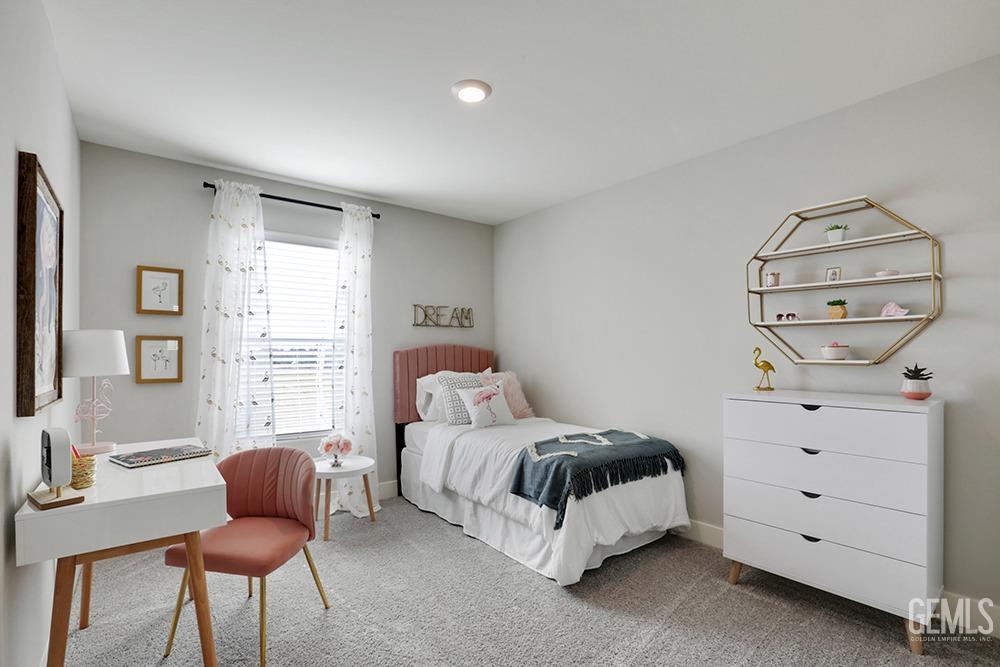 Undisclosed Address Bakersfield, CA 93314 - Photo 8 of 13 a bedroom with a bed chair and a window