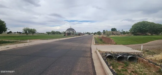 a view of a city street with a house