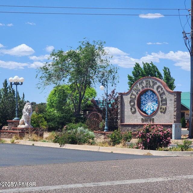 2642 West Foothill Circle, Unit 13 Snowflake, AZ 85937 - Photo 18 of 19 a sign board with buildings in the background