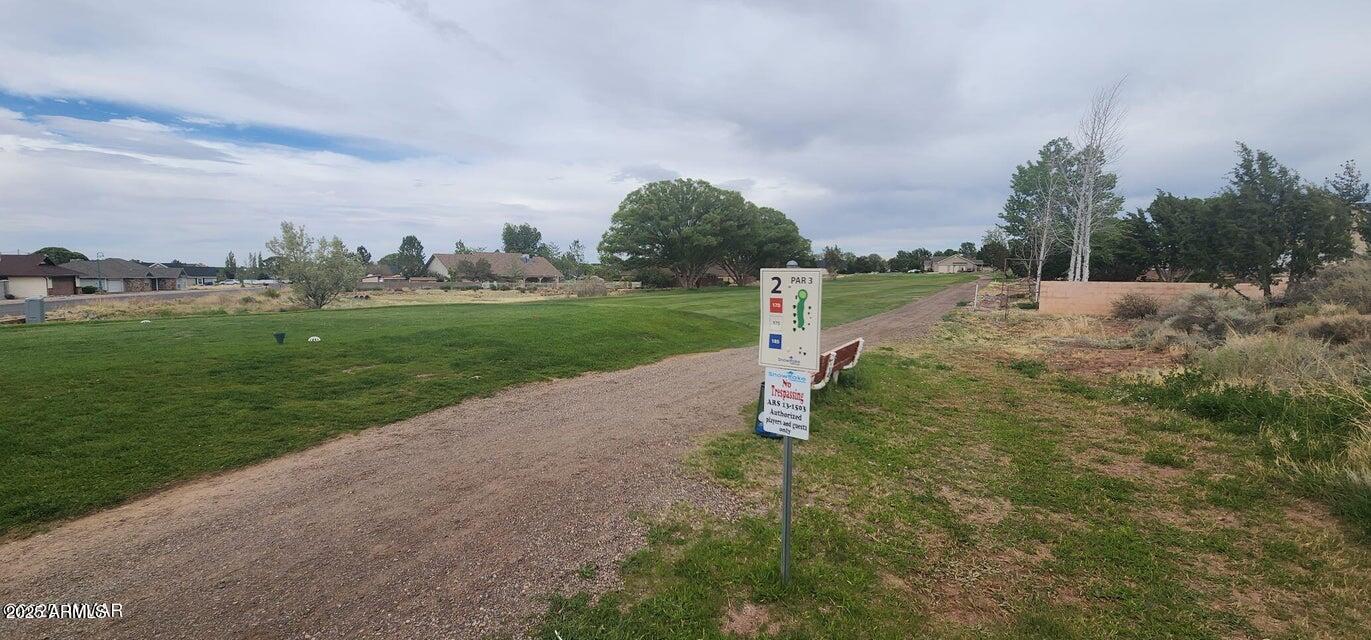 2642 West Foothill Circle, Unit 13 Snowflake, AZ 85937 - Photo 9 of 19 a view of a road with a big yard and palm trees
