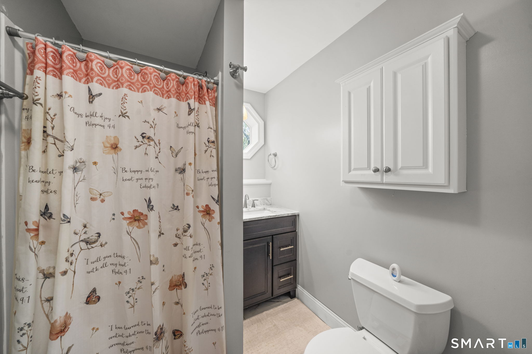 1118 Spindle Hill Road Wolcott, CT 06716 - Photo 26 of 38 a bathroom with a toilet and a shower curtain