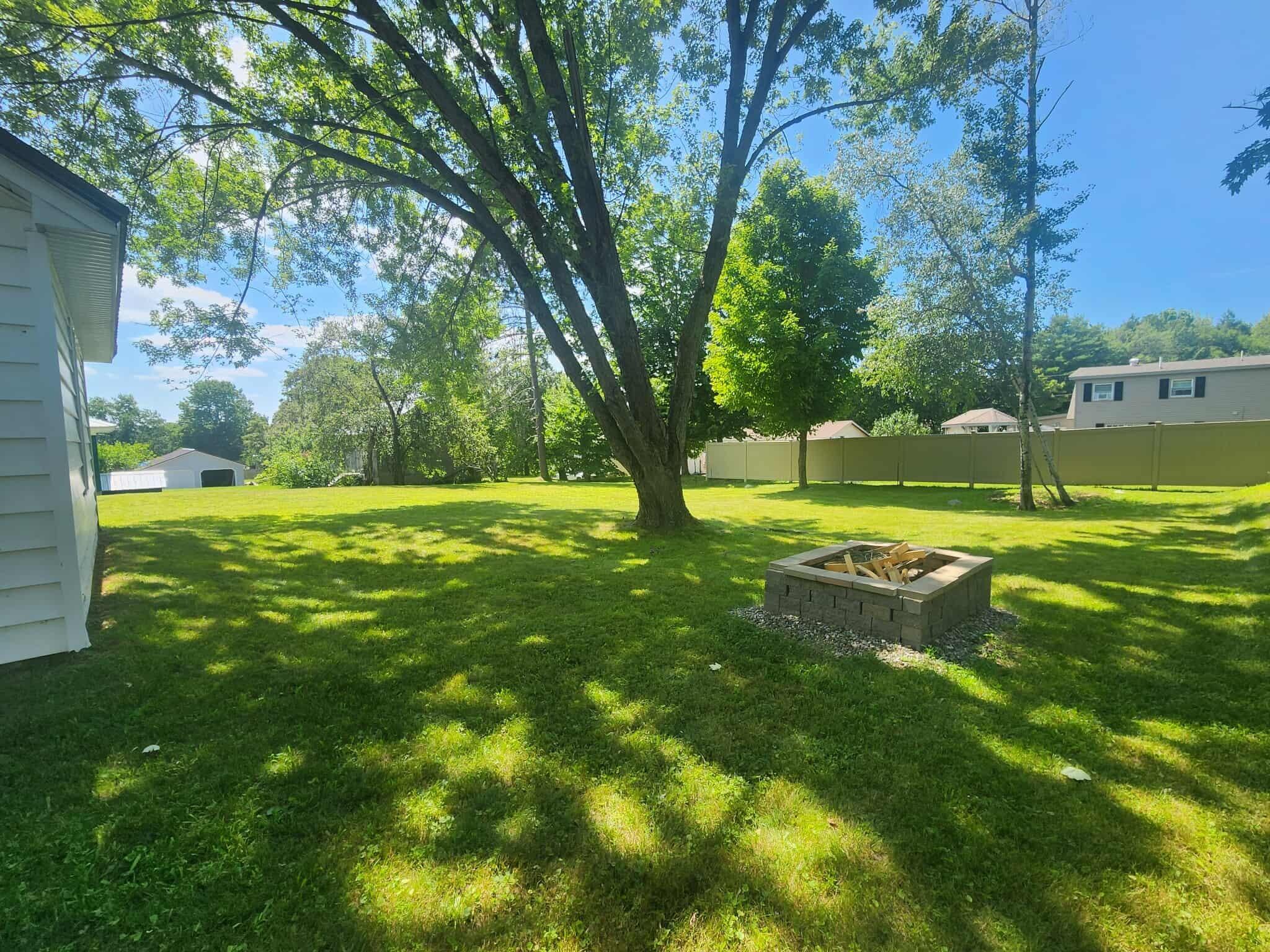 34 Cedar Street East Millinocket, ME 04430 - Photo 39 of 40 firepit in backyard