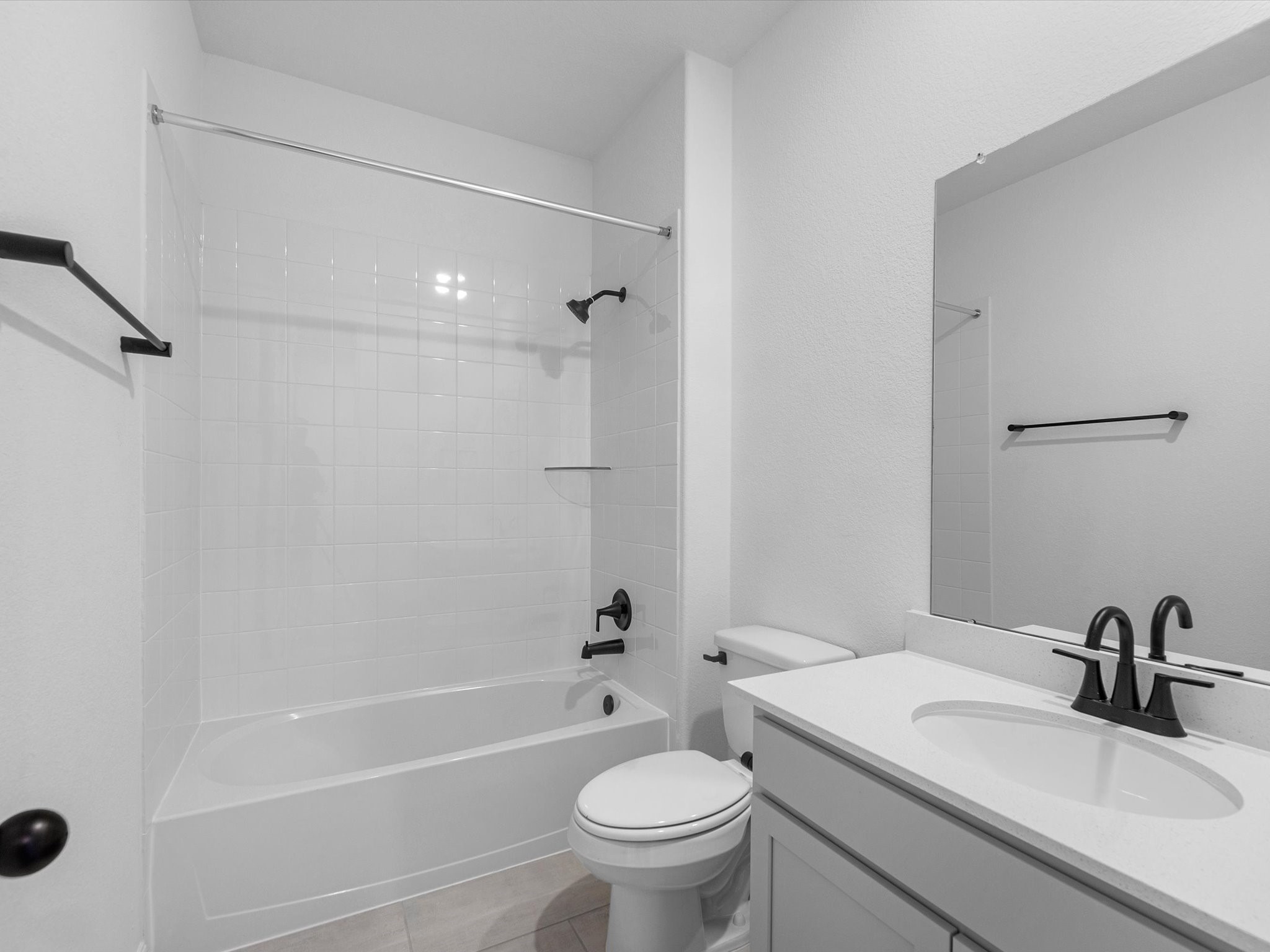 511 Selaura Street Rosenberg, TX 77471 - Photo 18 of 30 a bathroom with a sink a toilet and a mirror