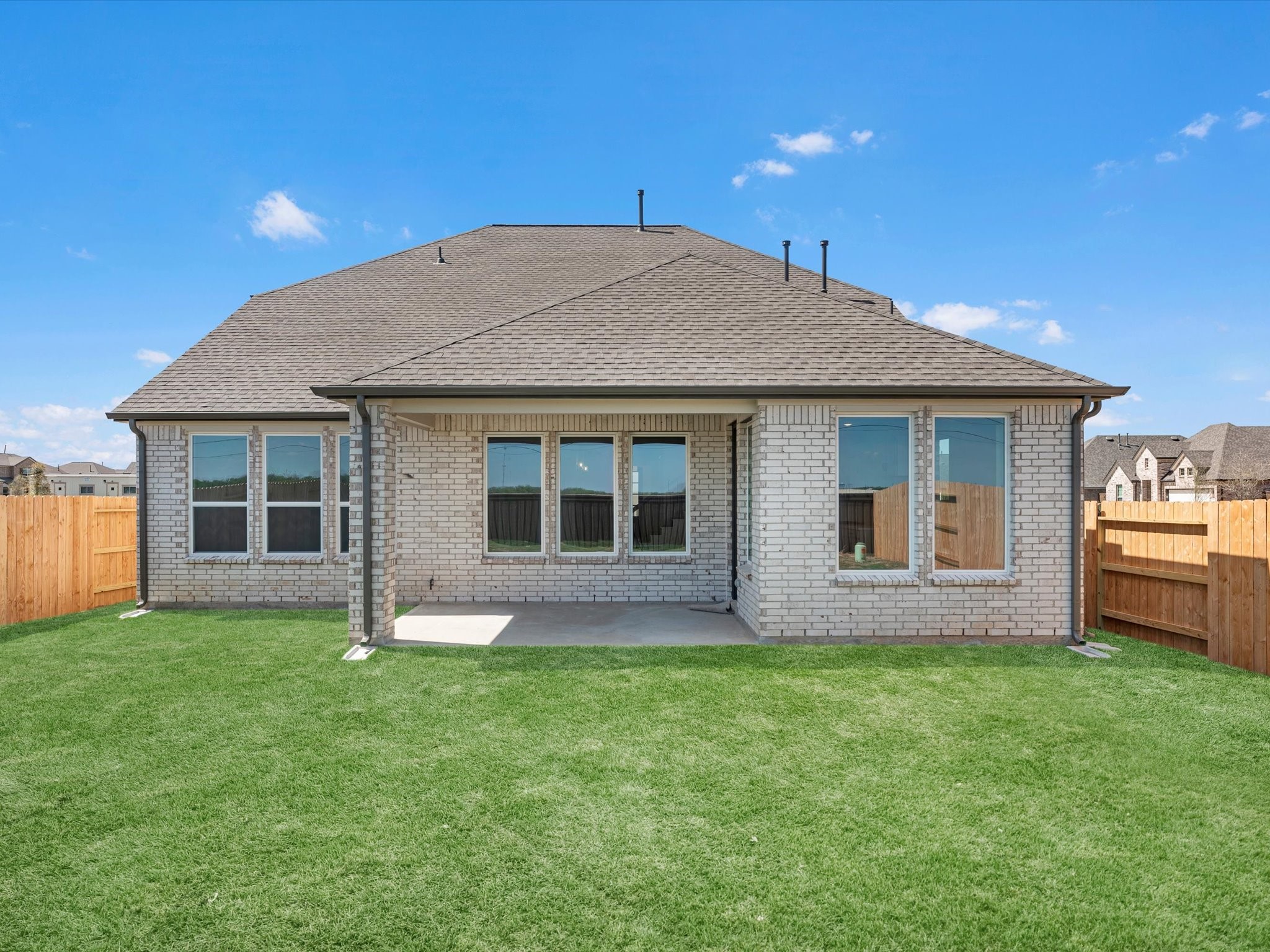 511 Selaura Street Rosenberg, TX 77471 - Photo 25 of 30 a front view of a house with a garden and yard