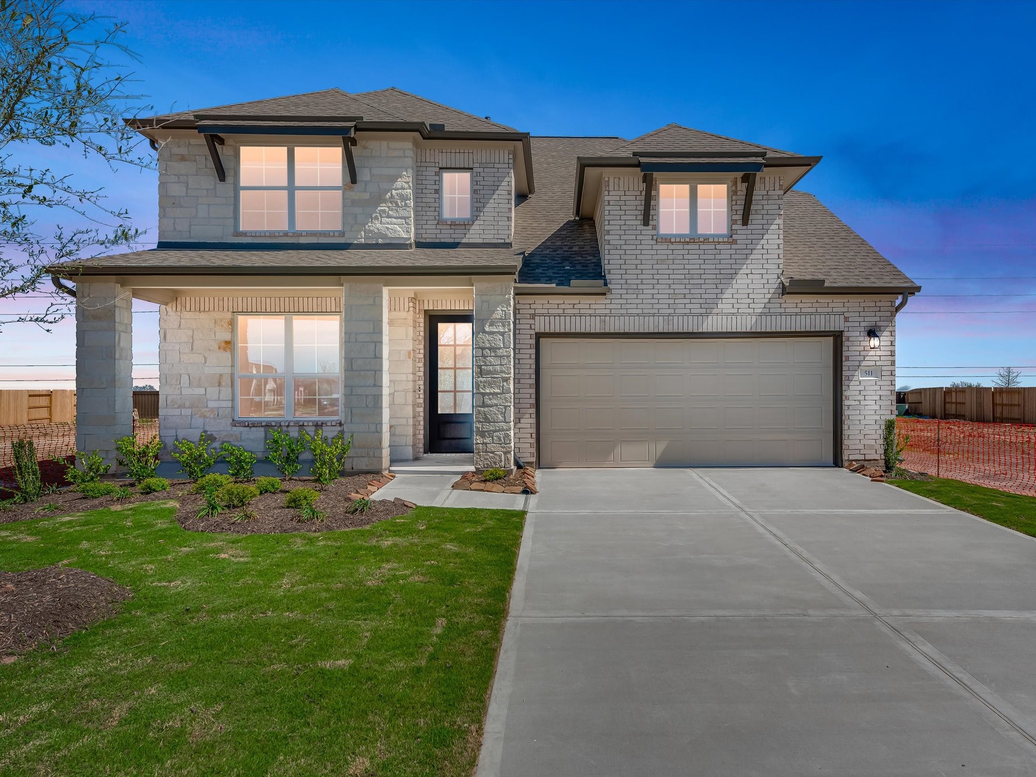 511 Selaura Street Rosenberg, TX 77471 - Photo 26 of 30 a front view of a house with a yard and garage