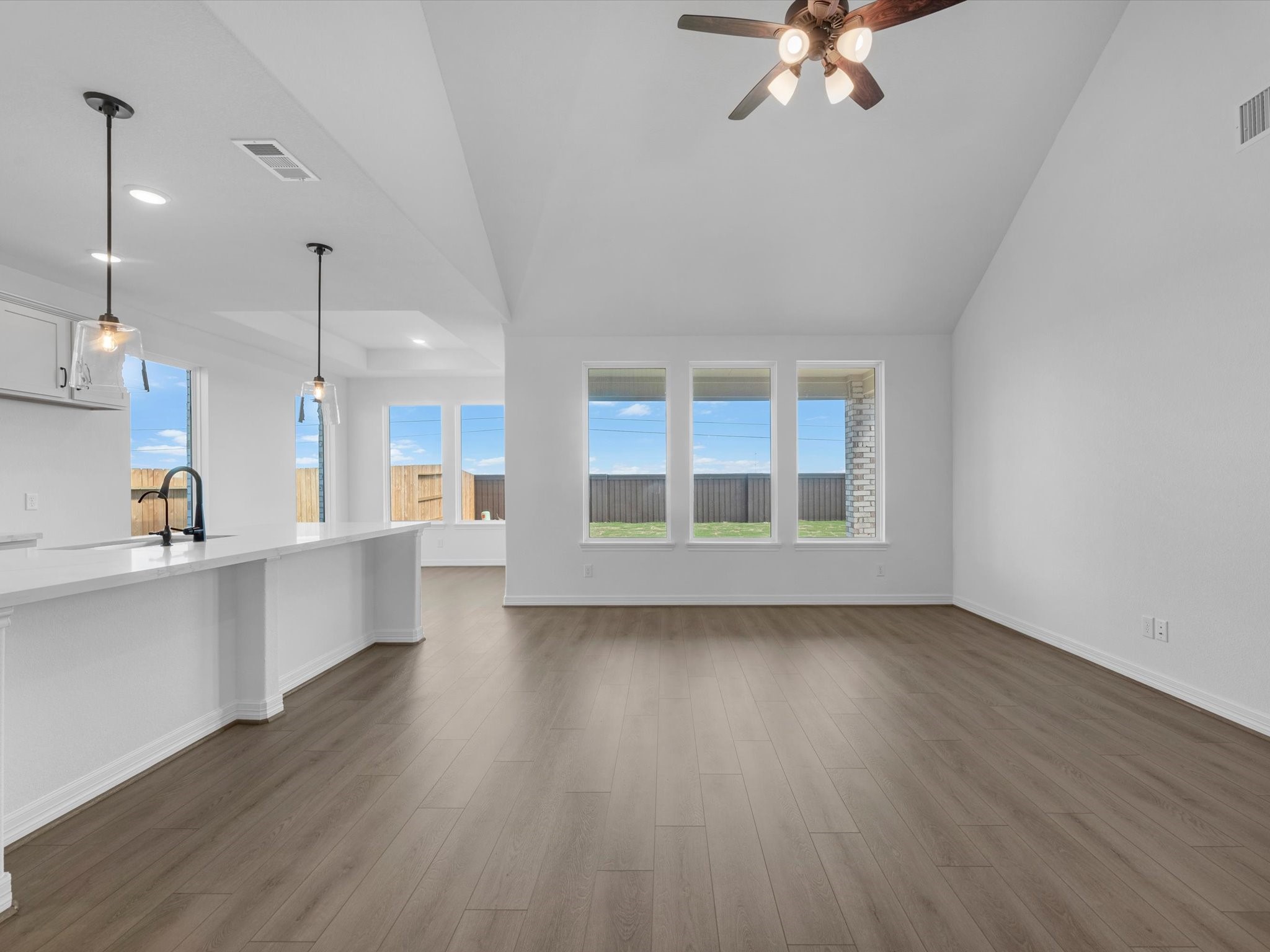 511 Selaura Street Rosenberg, TX 77471 - Photo 6 of 30 a view of a kitchen with a sink stainless steel appliances and cabinets