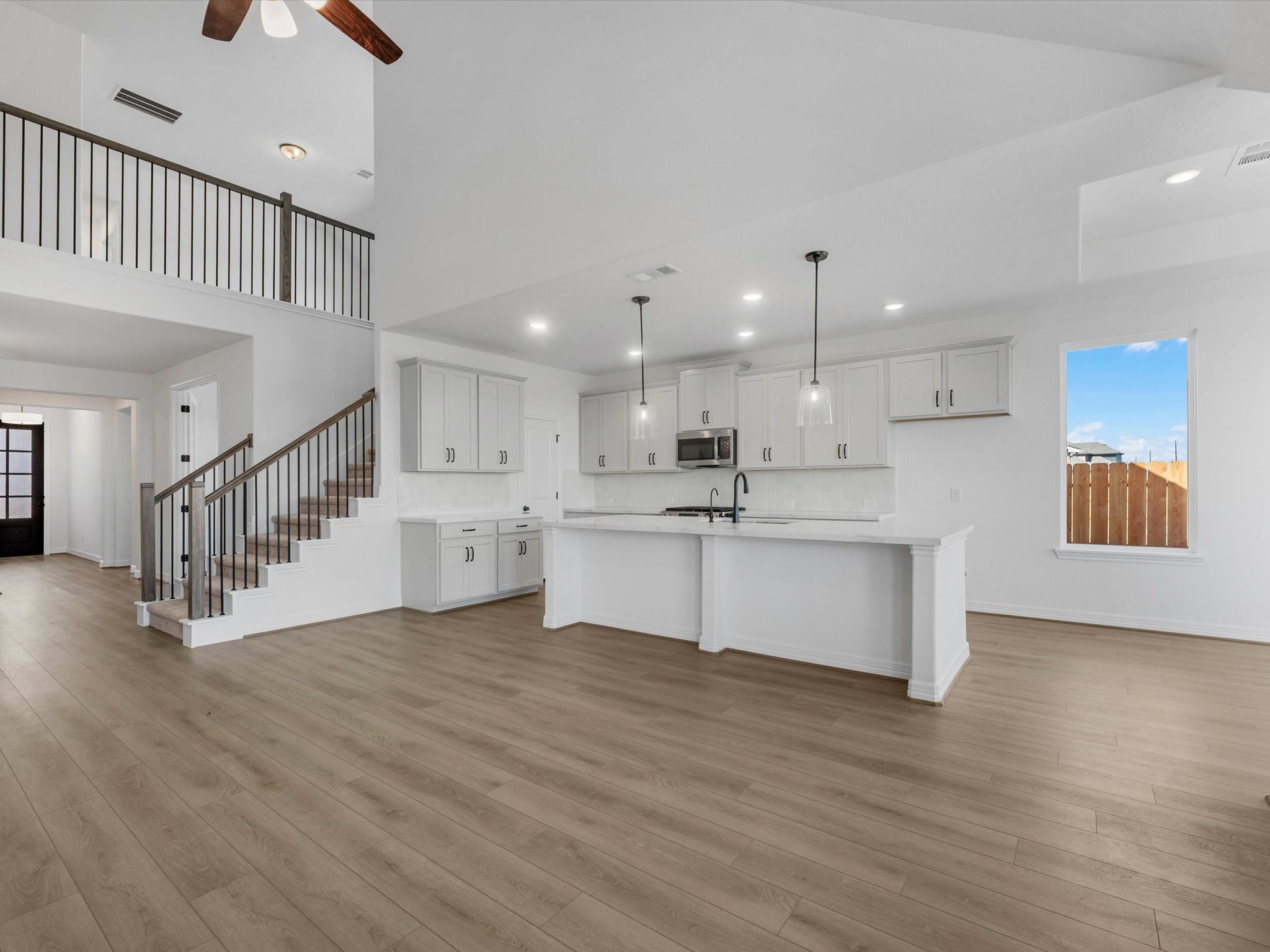 511 Selaura Street Rosenberg, TX 77471 - Photo 7 of 30 a view of kitchen with wooden floor and electronic appliances