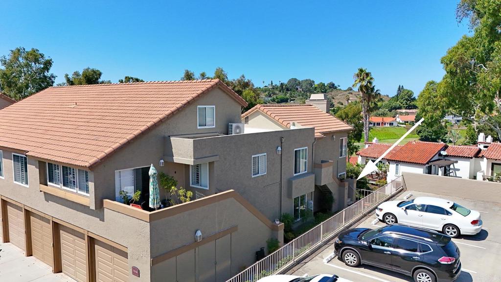 930 Via Mil Cumbres, Unit 52 Solana Beach, CA 92075 - Photo 13 of 34 an aerial view of a house with a yard