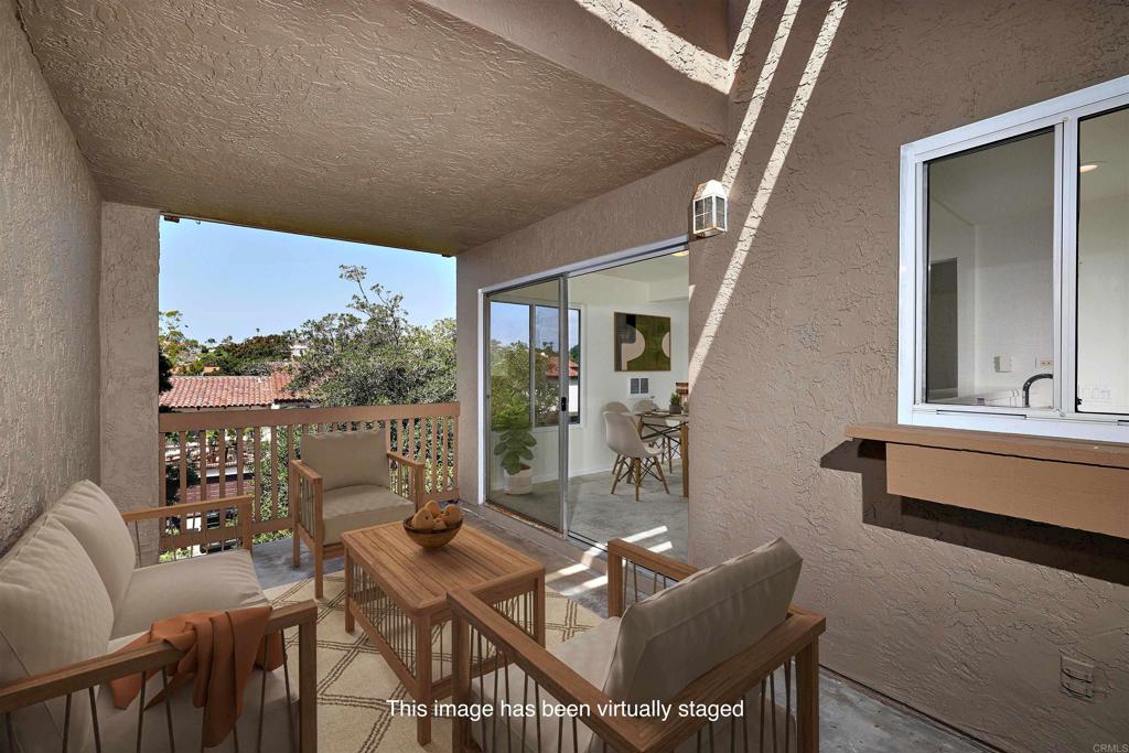 930 Via Mil Cumbres, Unit 52 Solana Beach, CA 92075 - Photo 19 of 34 a living room with furniture and a large window