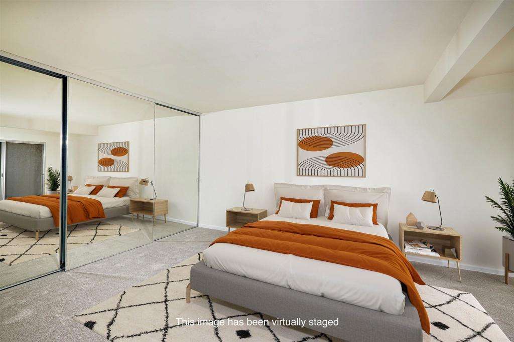 930 Via Mil Cumbres, Unit 52 Solana Beach, CA 92075 - Photo 22 of 34 a bedroom with a bed and window