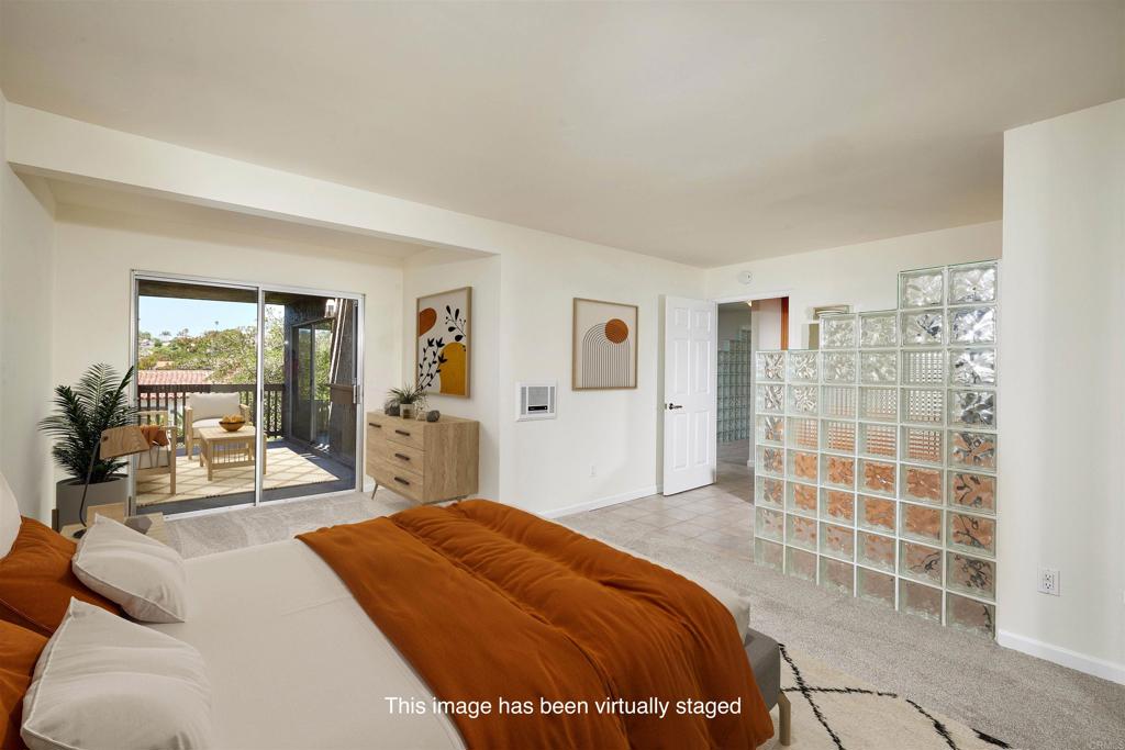930 Via Mil Cumbres, Unit 52 Solana Beach, CA 92075 - Photo 23 of 34 a bedroom with a large bed and a window