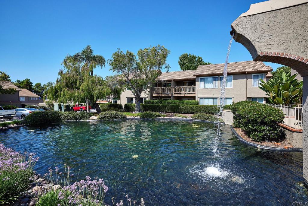 930 Via Mil Cumbres, Unit 52 Solana Beach, CA 92075 - Photo 27 of 34 a view of a house with a yard