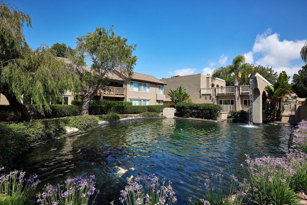 930 Via Mil Cumbres, Unit 52 Solana Beach, CA 92075 - Photo 29 of 34 a view of a house with a yard